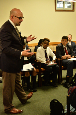 Lawyer Scott Griffith of Rawle & Henderson speaks with Holy Cross School students