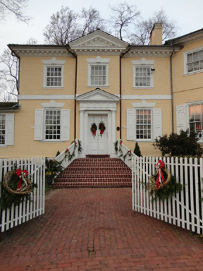 Image of the facade of Laurel Hill Mansion with winter holiday decorations