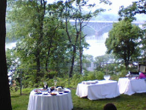 Tables covered in white linen make a lovely site in the garden at Laurel Hill Mansion